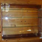 rimu wall unit with glass doors.